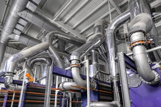 Insulated hydronic piping, pumps and valves in a mechanical room